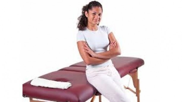 Massage Therapist With Message Table